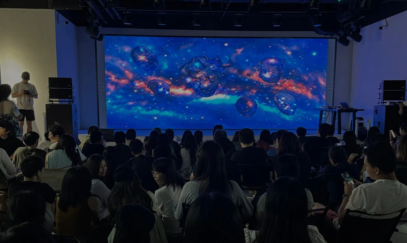 A full auditorium at the AI Artist festival, China.