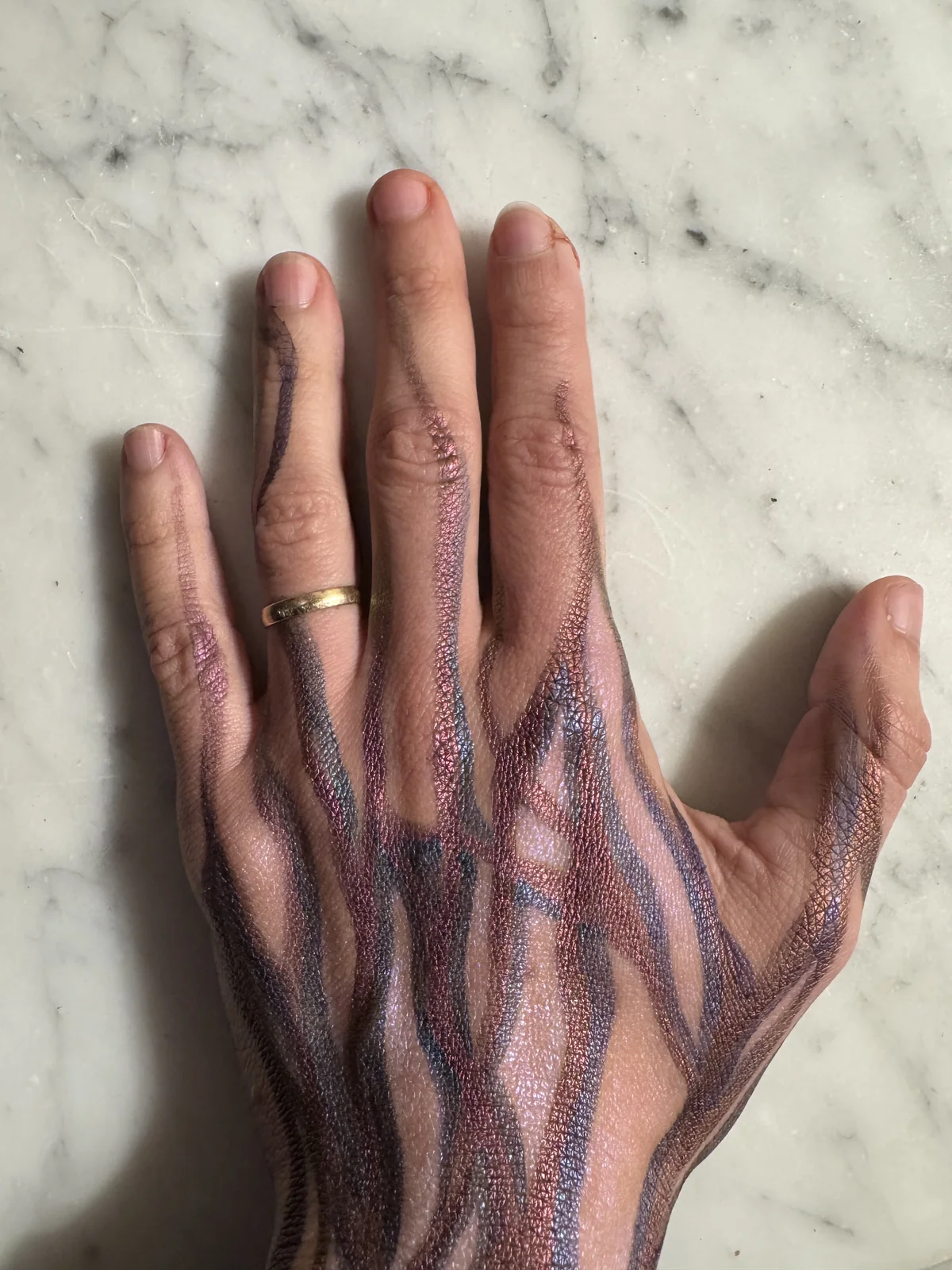 A painted hand, from the body painting.