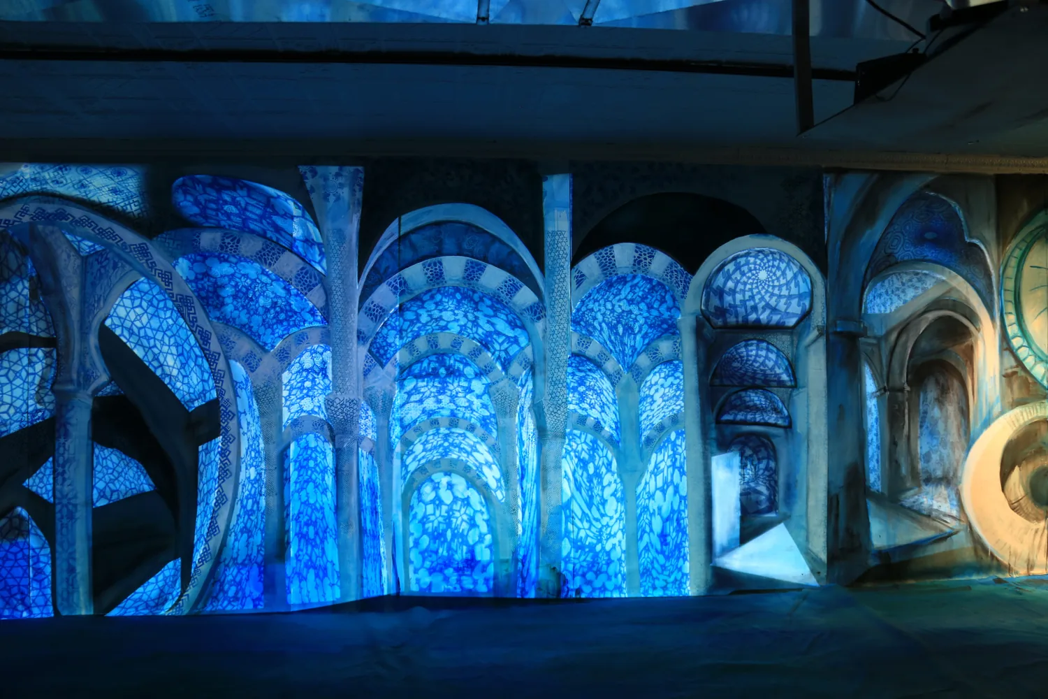 The projection-mapped installation at Babycastles, patterns thrown across the gallery.