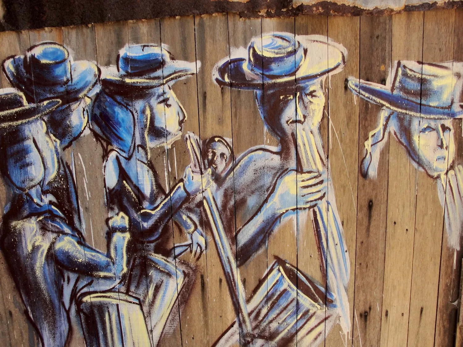 Musicians painted straight onto the boards of a house, Chile.