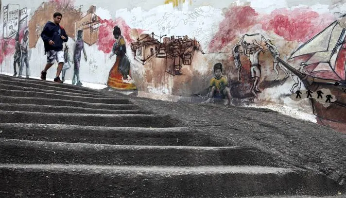 Rio de Janeiro. Figures from another century beside a stairway in the port zone.
