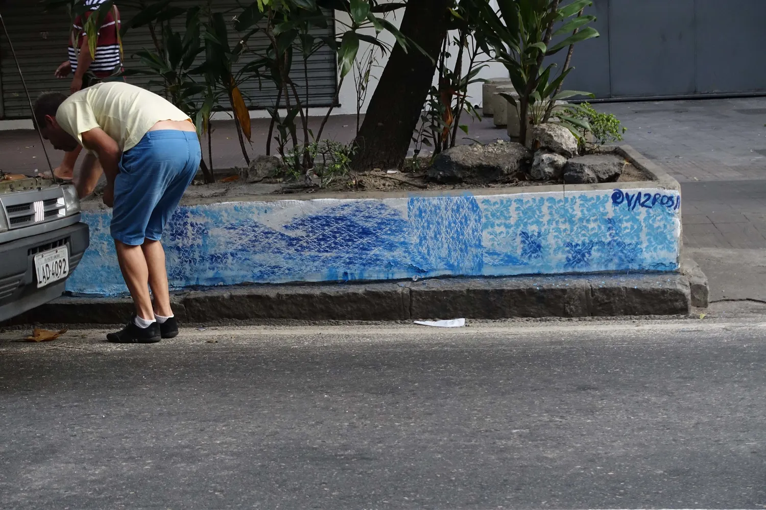A painted planter in the middle of a Rio street.