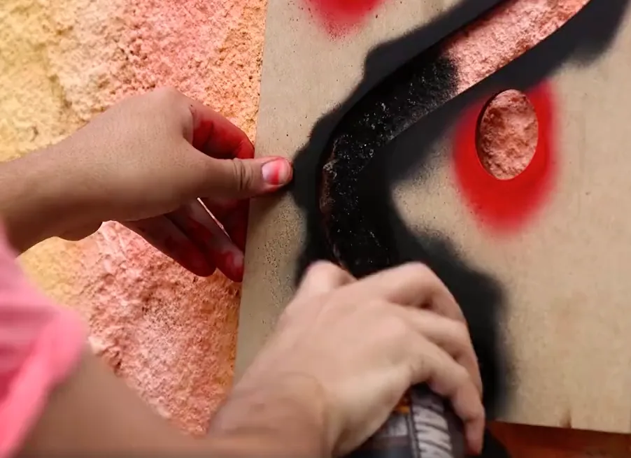 Spraying through a laser-cut stencil