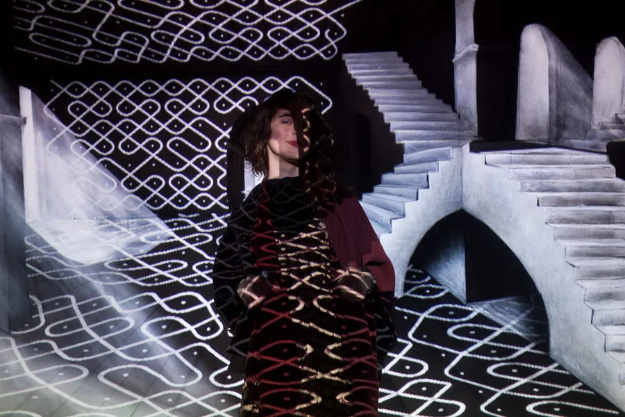 The Ethnocomputing Experiments installation, a Sona line drawing projected over a perspective painting.