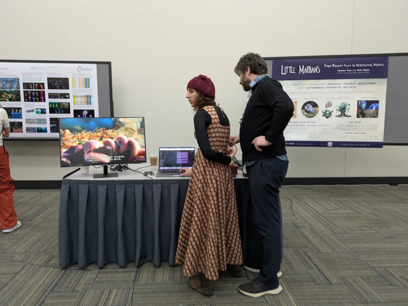 The poster session, with the films playing