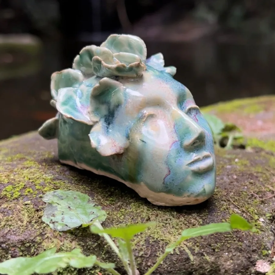 The same head, glazed and fired